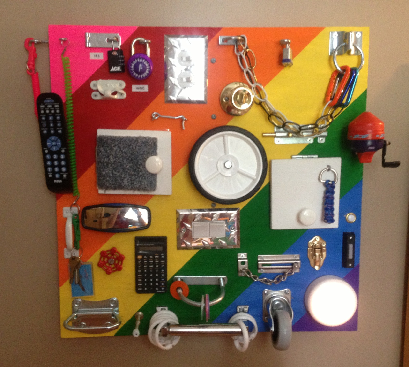 A board with locks, or a remote control for a child with their own hands (photo examples)