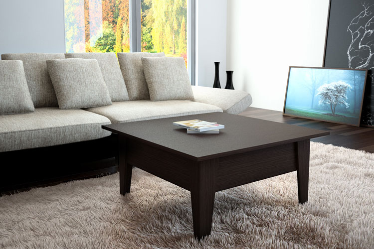 La combinazione di un tappeto chiaro con un tavolo trasformatore scuro nel soggiorno