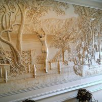 unusual interior of the apartment with a bas-relief picture