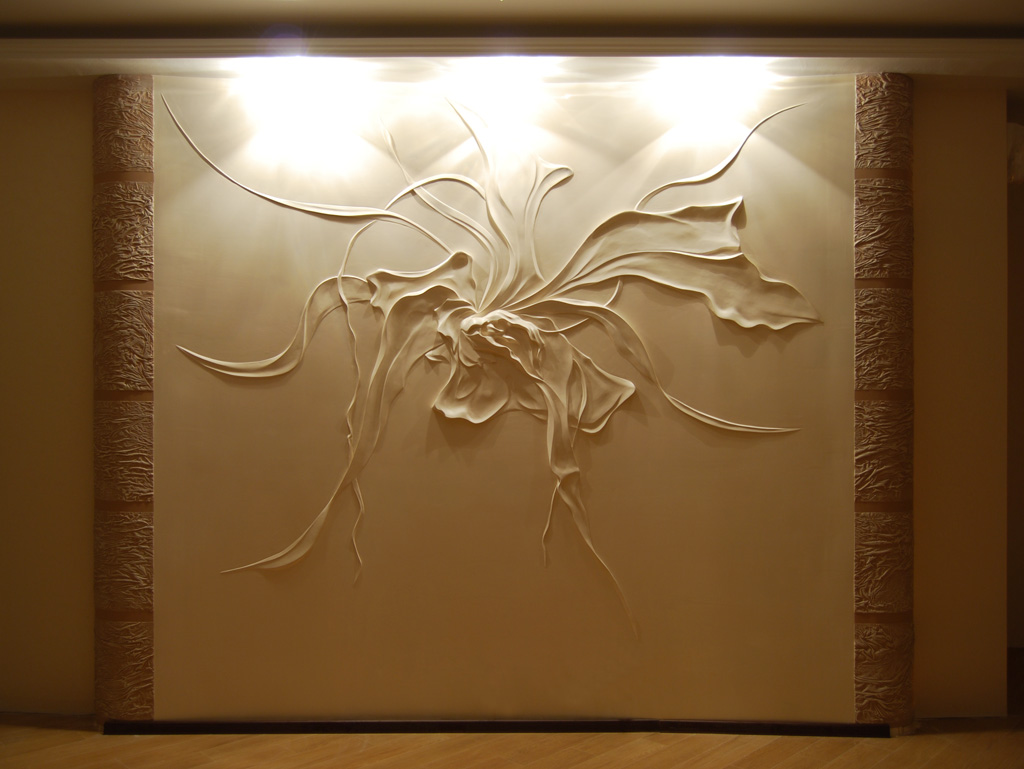 unusual decor of the corridor with a bas-relief