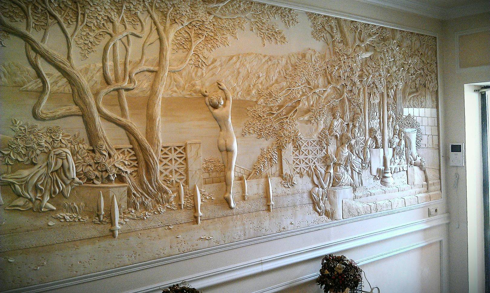bright decor of the hallway with a bas-relief