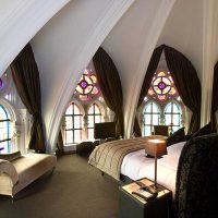bright interior of the bedroom in the Gothic style photo