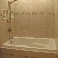 An example of a bright style of a bathroom in beige color picture