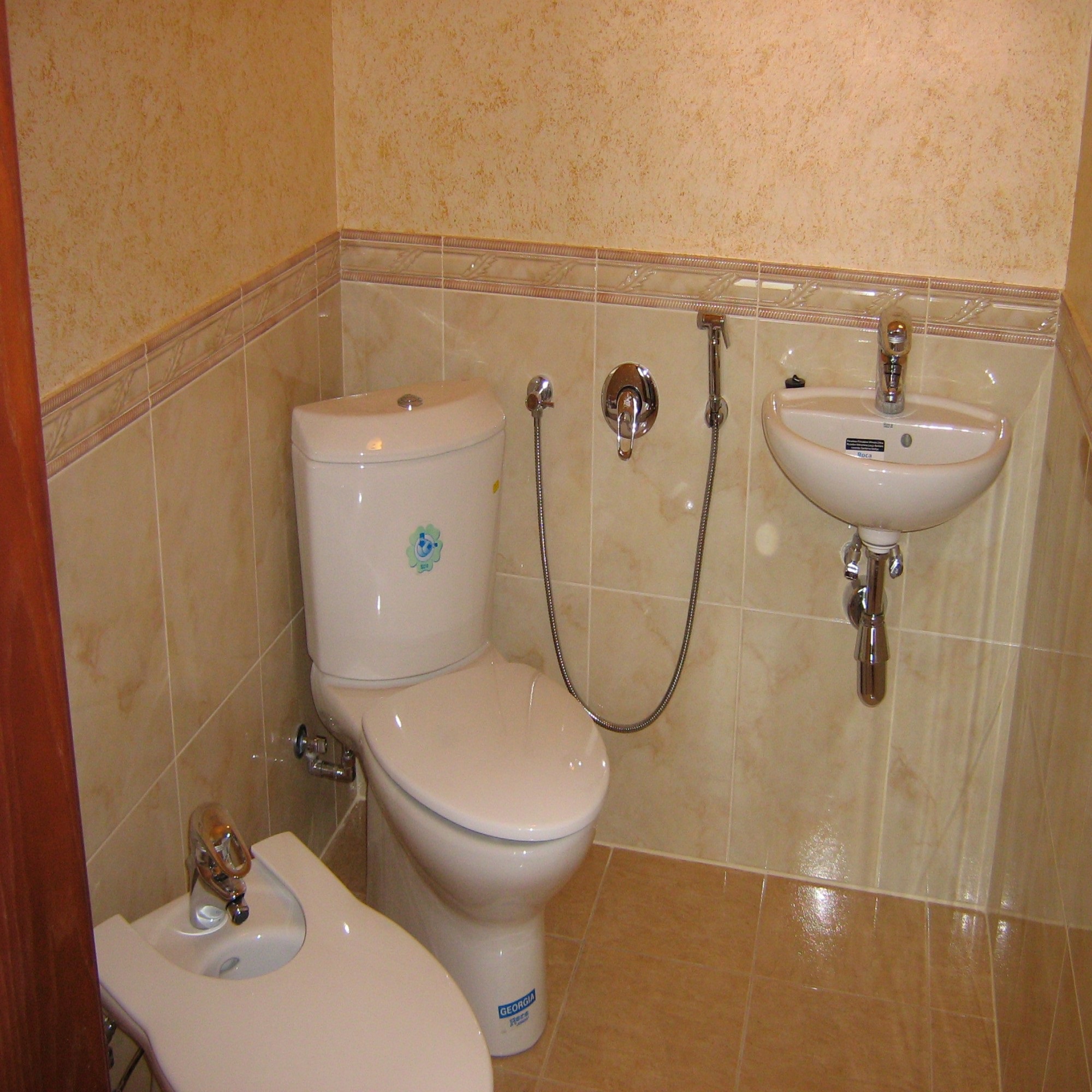 An example of a bright style of a bathroom in beige color