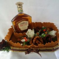 Bouquet as a gift to a man with alcohol and sweets