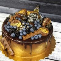 Cake for a beloved man with a bottle of cognac