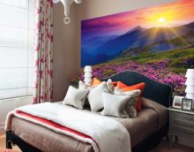 Sunset over the mountains in the bedroom with photo wallpaper