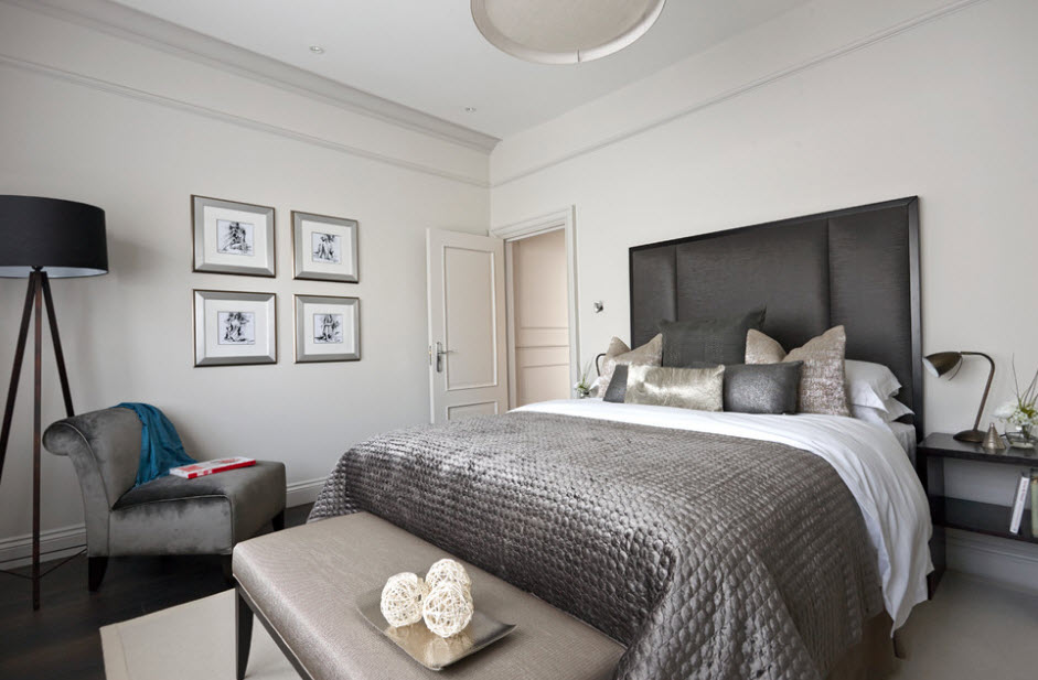 Bright walls in the bedroom with a dark gray bed