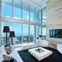 Panoramic glazing in the interior of the living room of a residential building