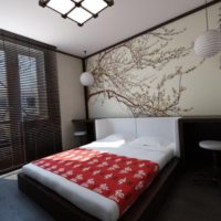 Japanese-style bedroom with photo wallpaper over the bed