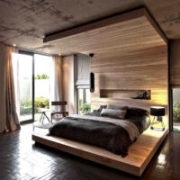 Wood and concrete in a bedroom interior of a country house