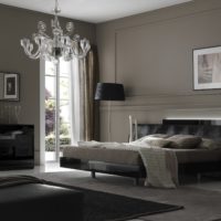 Gray painted walls in a room with a black bed