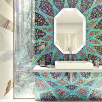 Motley mosaic composition around the washbasin