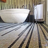 Narrow lines in the mosaic of the bathroom