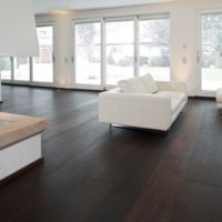 Dark laminate in a living room with white walls