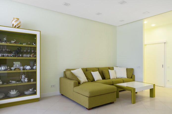 Divano angolare verde oliva nel design del soggiorno