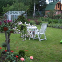 White garden furniture on the lawn