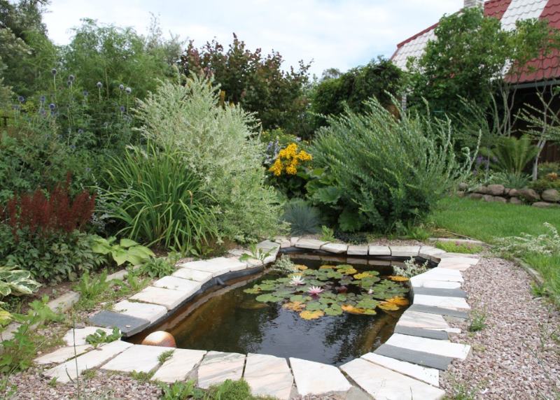 Artificial pond as a decoration of the garden