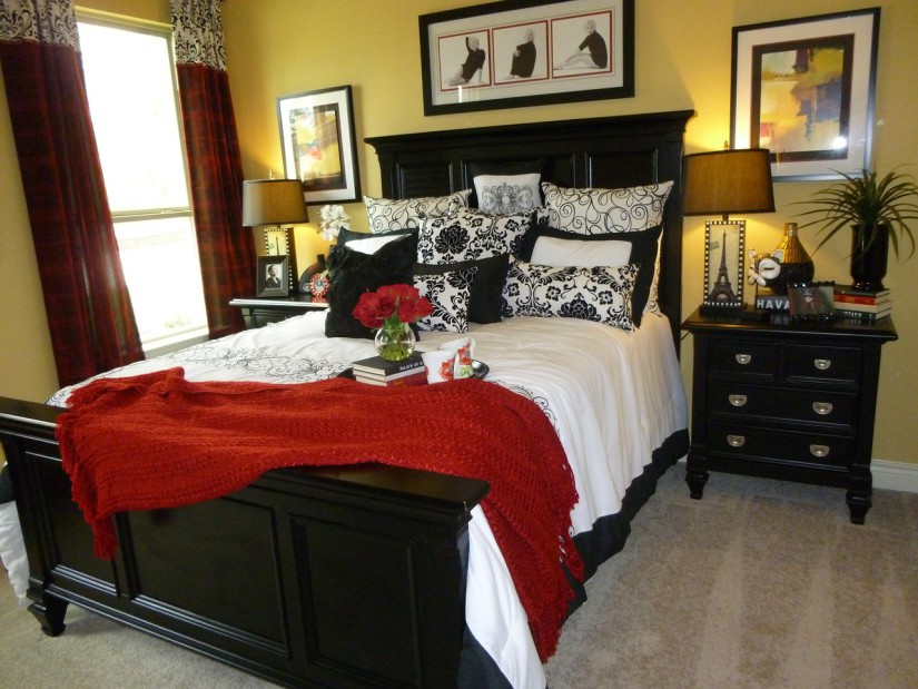 Dark brown bed in the bedroom with yellow walls