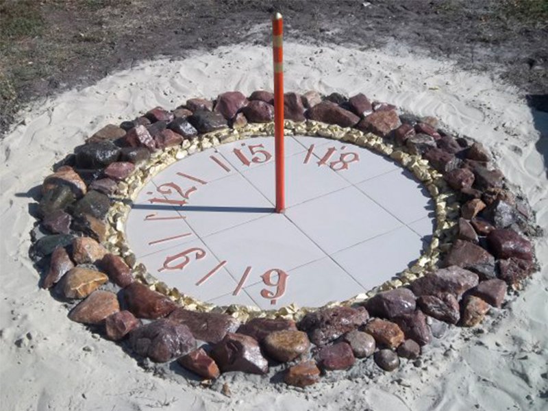 Sundial in the landscape of a private garden