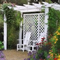 White pergola with a bench for relaxation