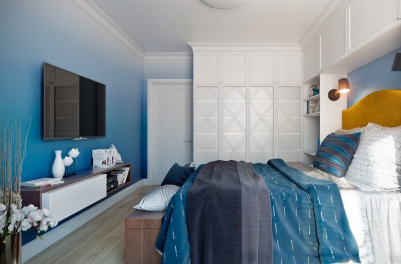 Il design della camera da letto di una casa privata nei toni del blu