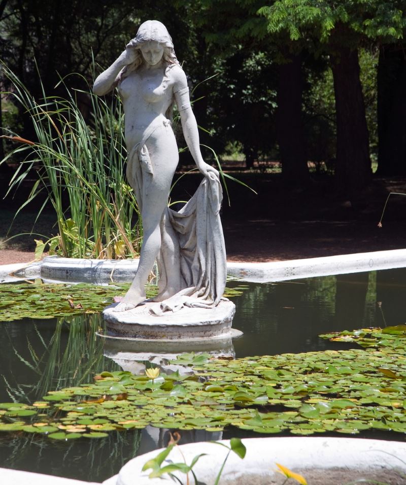 Sculpture of a girl bather in the design of a garden pond