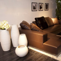 White vases and brown sofa