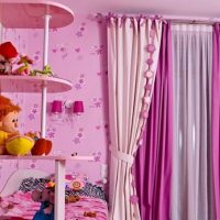 Pink curtains in a nursery