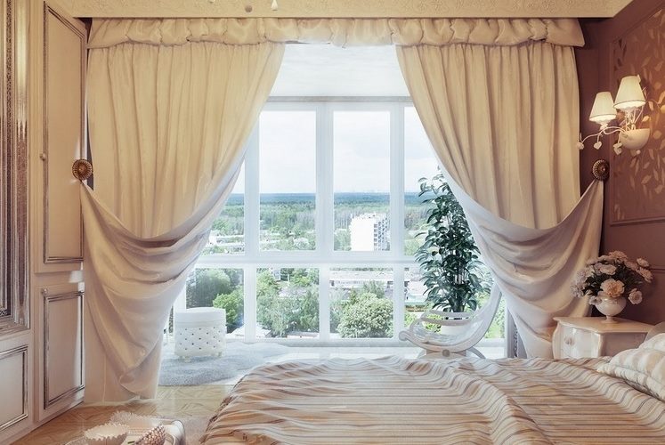 Bright Italian curtains on a panoramic window