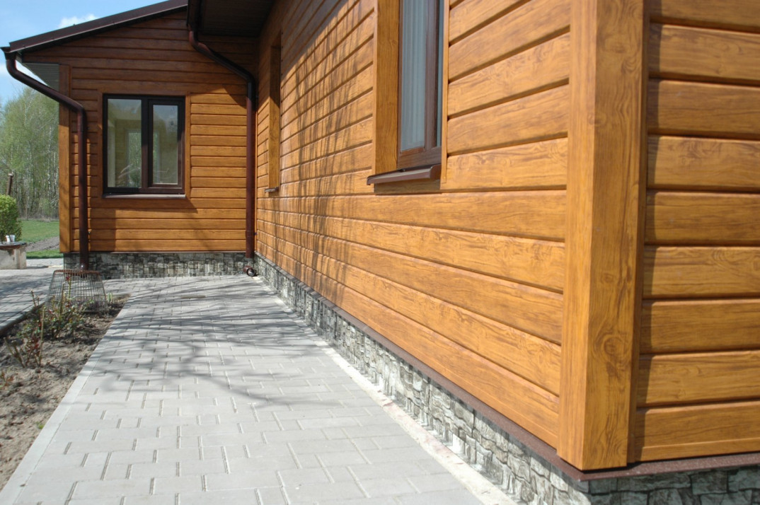 Wall of a private house with wooden siding