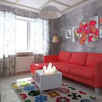 Canapé rouge dans un salon gris