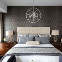 Gray paper wallpaper over the bed