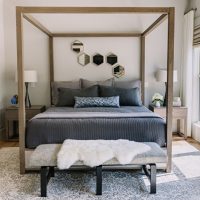 Wooden frame over gray bed