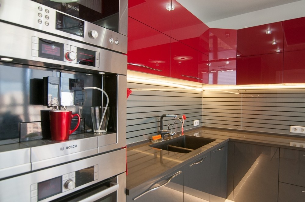 Red color in a high-tech style kitchen interior