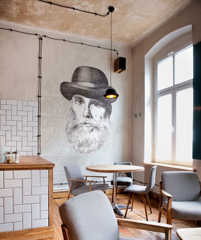 Portrait of a man in a hat on a kitchen wall