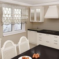 White kitchen furniture with black countertops