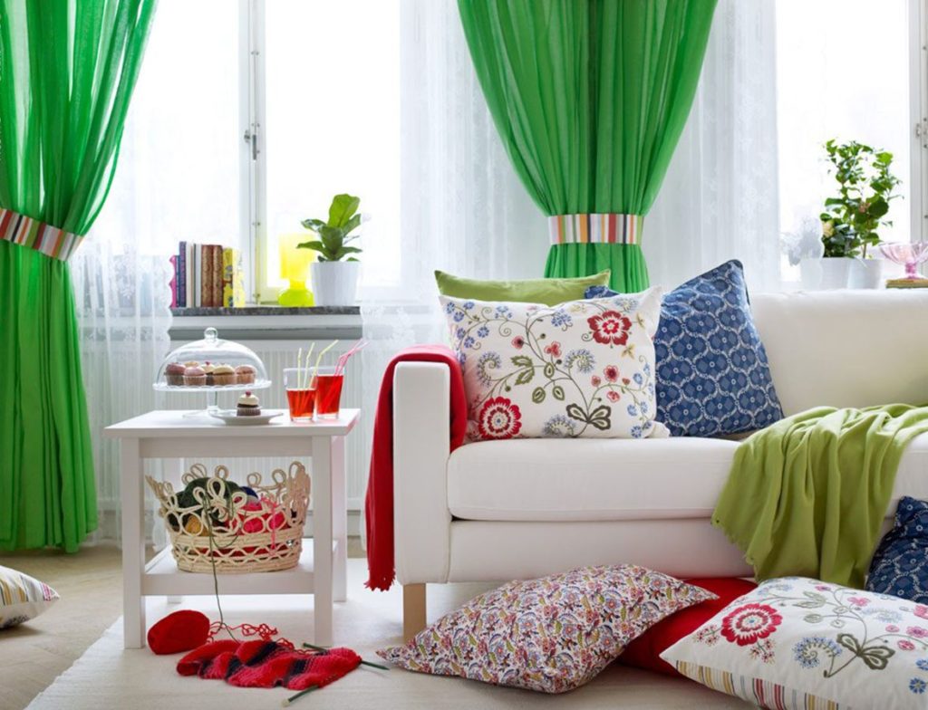 White furniture in a room with green curtains