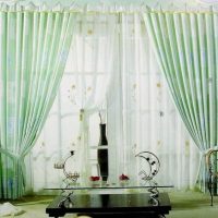 Decoration of the living room door with tulle curtains