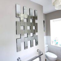 Rectangular mirror tiles in the interior of the bathroom