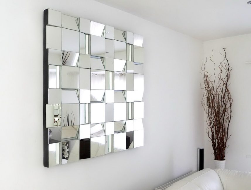 Panel on the wall of rectangular mirror tiles