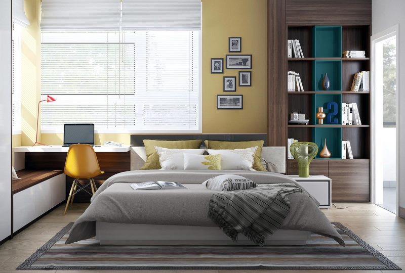 Grijs bed in een moderne slaapkamer