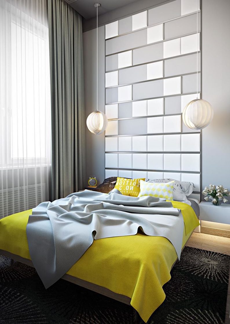 Pelēka guļamistaba ar dzeltenu gultas pārklāju uz gultas