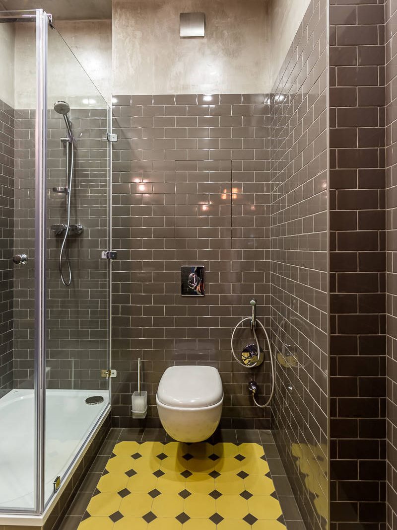 Brown ceramic tiles on the bathroom wall