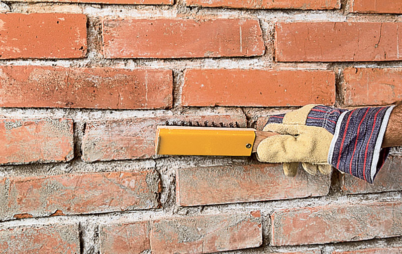 Nettoyer le mur de briques avant de peindre