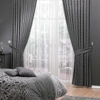 Grijs textiel in het ontwerp van de slaapkamer.