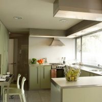 Design of a small kitchen with a large window