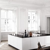 Spacious island kitchen in white