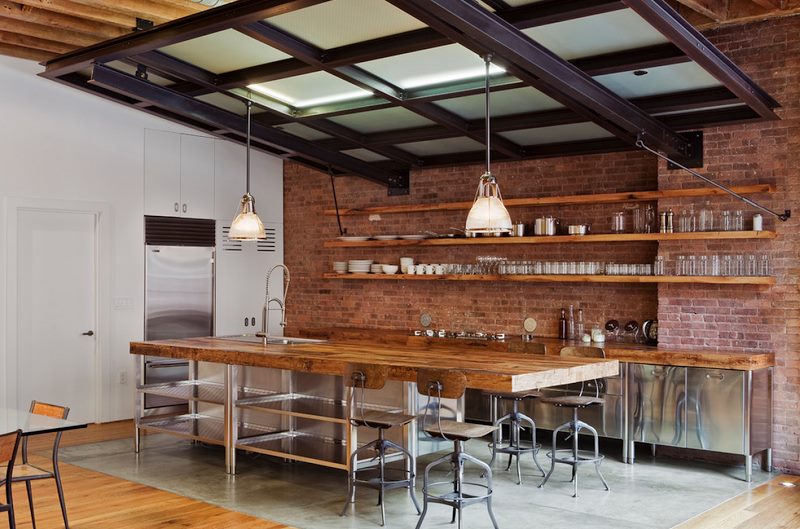 Modern kitchen with brick wall