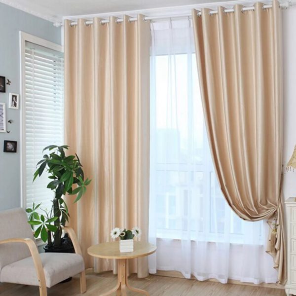 In 2019, translucent white curtains on grommets, not complemented by blackout curtains, are in fashion